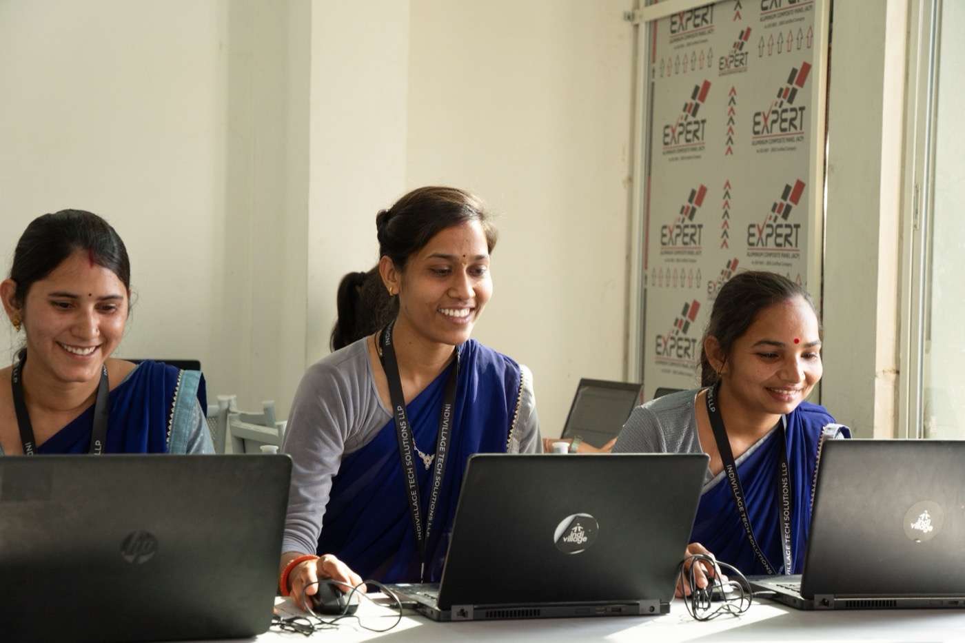 Operations floor at an IndiVillage rural technology centre — same team, same problems, year after year